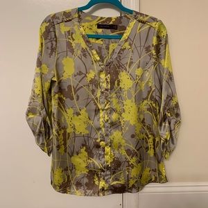 The limited neutral and neon blouse